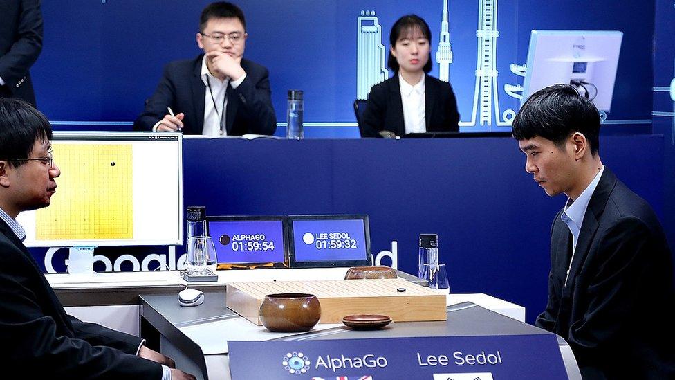 South Korean professional Go player Lee Se-Dol (R) prepares for his fourth match against Google's artificial intelligence program, AlphaGo, during the Google DeepMind Challenge Match