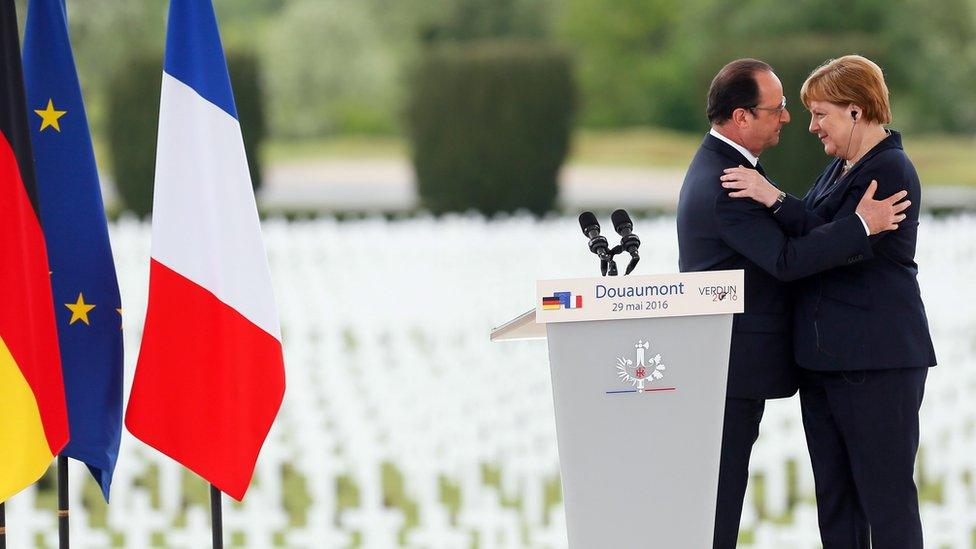 French President Francoise Hollande embraces Germany's Chancellor Merkel at the commemoration of the centenary of the Battle of Verdun