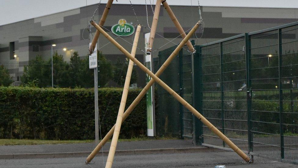 About 50 people from Animal Rebellion locked themselves on to barricades at the Arla site in Aylesbury, Buckinghamshire.