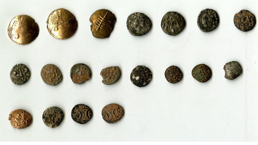 The full hoard of 19 coins, the bottom four are the coins believed to have come from another area