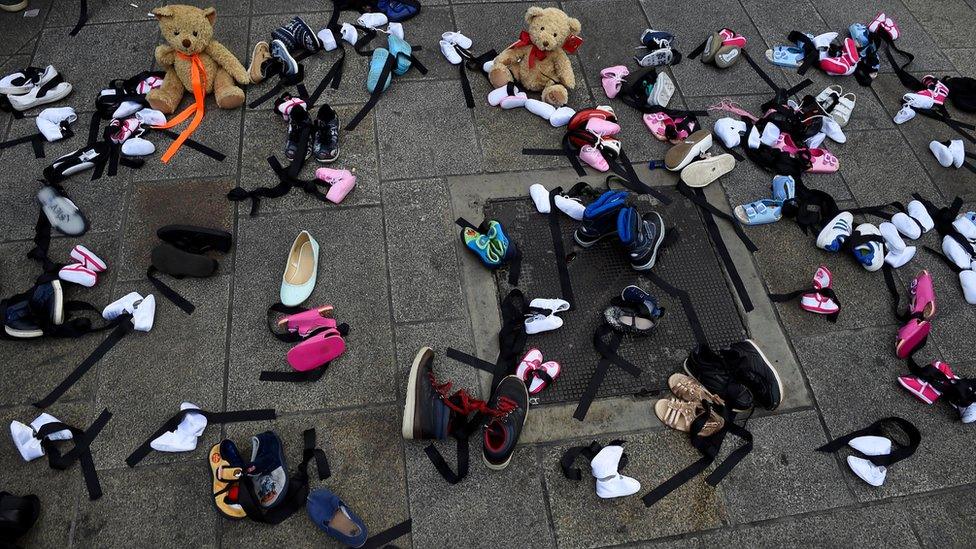 children's shoes laid on ground in Dublin