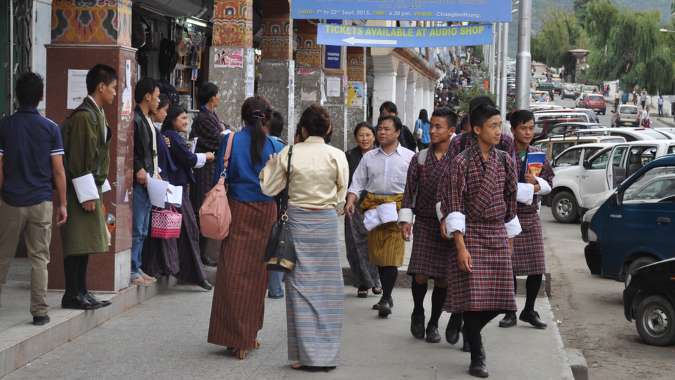 People walk in the street in Thimphu, capital of Bhutan (file photo)