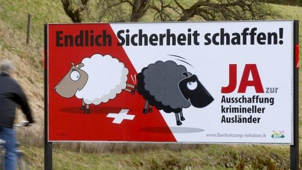 Posters of Swiss People's Party (SVP) demanding to deport criminal foreigners are displayed beside a road in Adliswil, Switzerland, on 11 February 2016