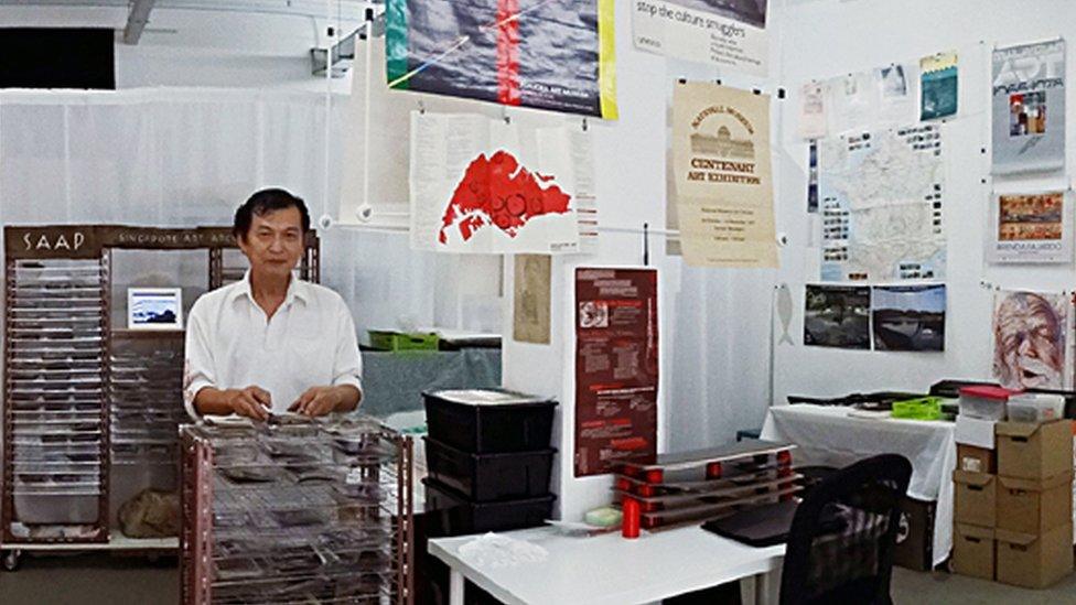 Picture of Koh Nguang How at a 2014 exhibition of some of his artefacts