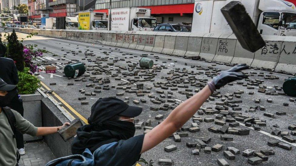 Protestors throw bricks to the road in Wong Tai Sin district on November 11, 2019 in Hong Kong, China.