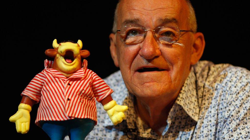 Jim Bowen with Bullseye mascot Bully