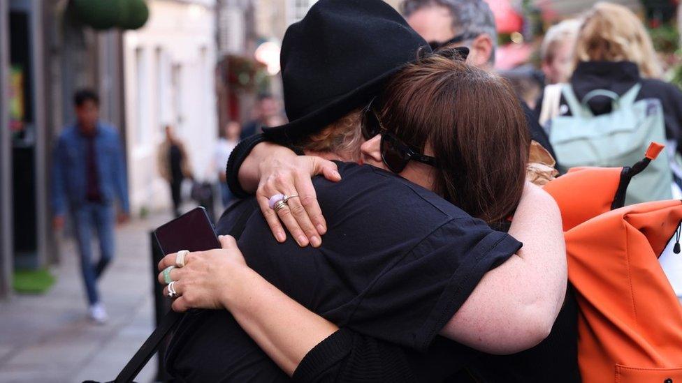 Mourners at the Irish Rock 'n' Roll Museum in the Temple Bar area of Dublin