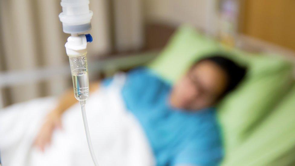 Patient lying in a hospital bed