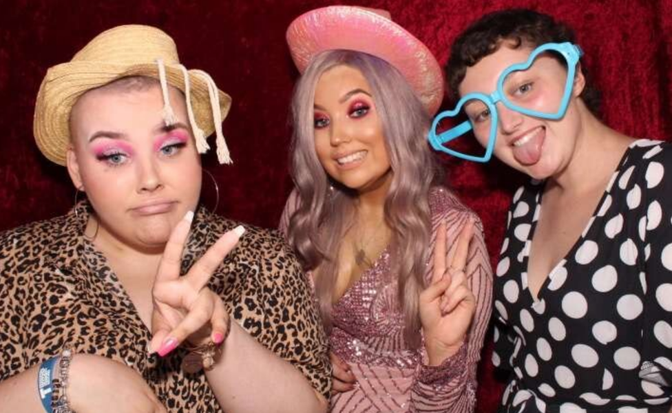 Charlie Aldred, Sophie Wheldon and Georgina Haywood (left to right) pictured in a photo booth for Ms Wheldon's 21st birthday