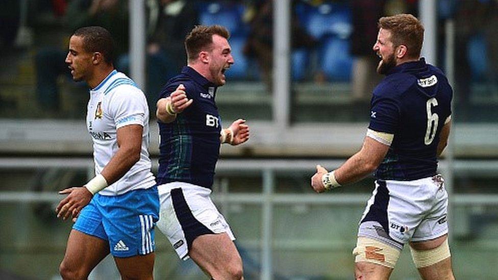 Stuart Hogg and (middle) celebrates Scotland's opening try with John Barclay (right)