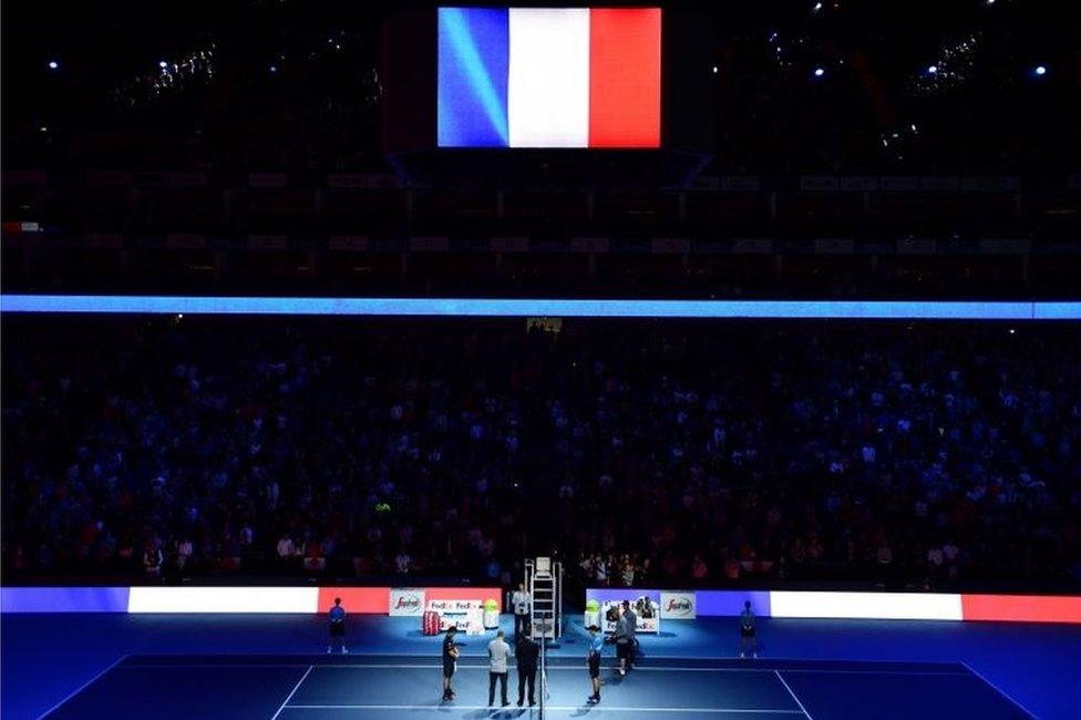 Serbia's Novak Djokovic and Japan's Kei Nishikori stand for a minute's silence during day one of the ATP World Tour Finals at the O2 Arena, London