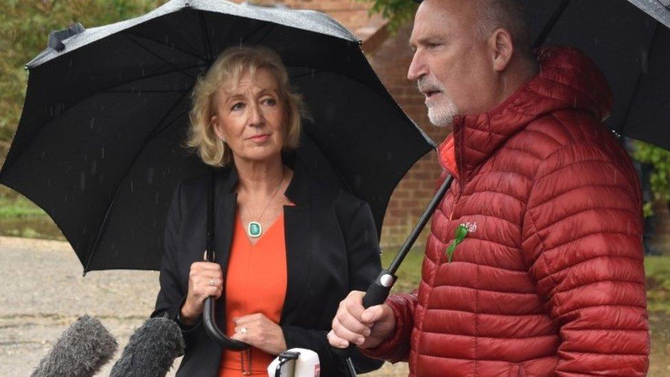 Andrea Leadsom MP and Harry Dunn family spokesman Radd Seiger arrive to speak to the media in Brackley, Northamptonshire, where the MP called on Donald Trump to personally intervene to ensure suspect Anne Sacoolas faces trial over teenager Harry Dunns death a year ago.