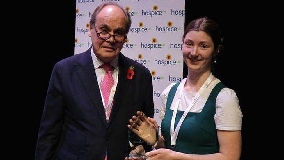 Jess Sheridan being handed an award