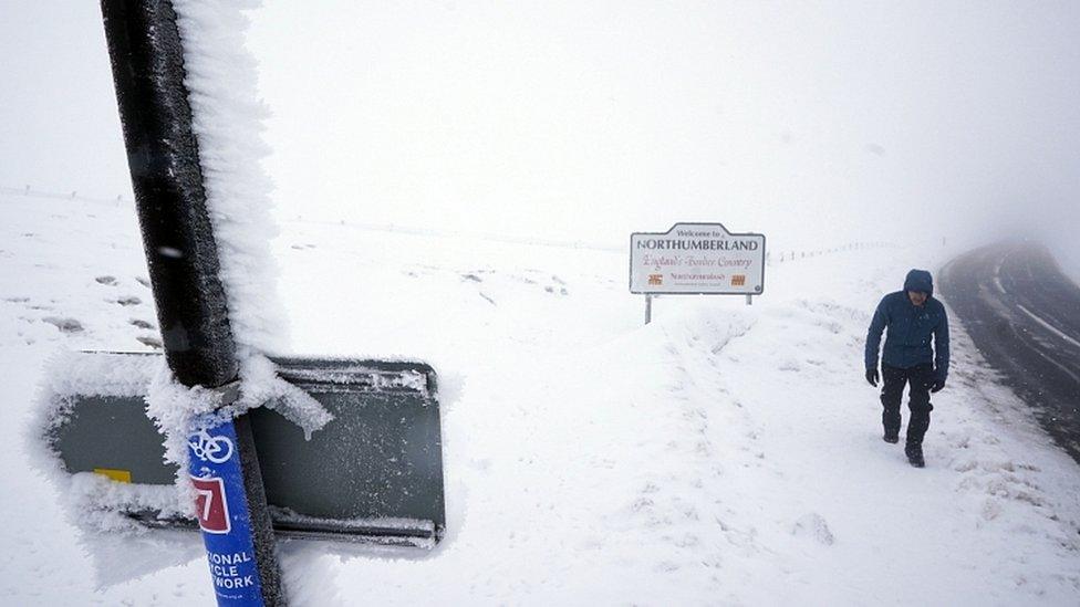 Man walking into Cumbria from Northumberland