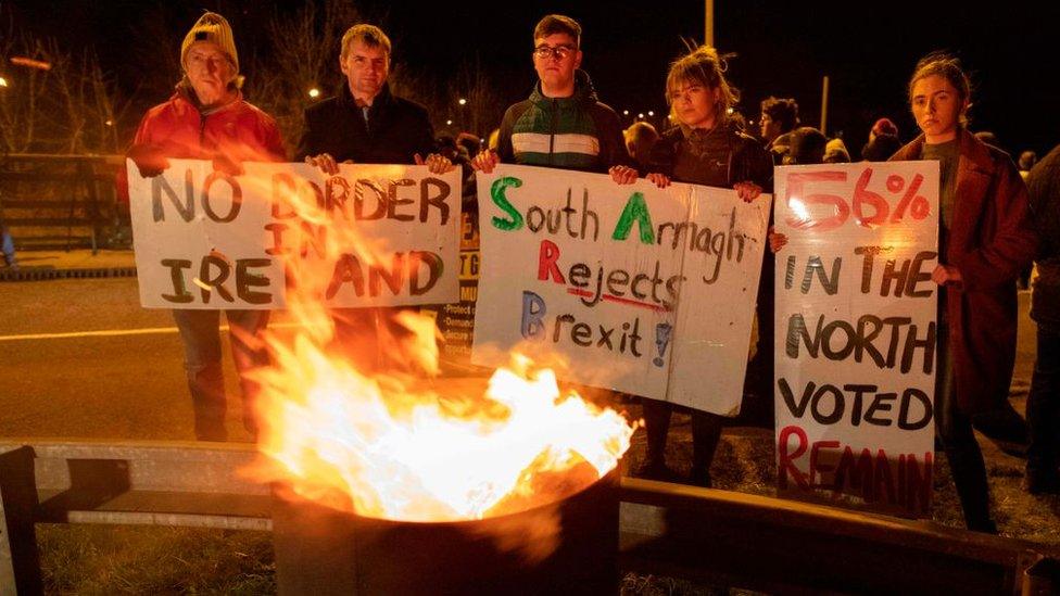 northern-irish-border-protestors-holding-up-signs