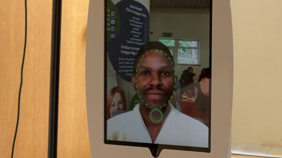 Computer tablet scanning a man's face