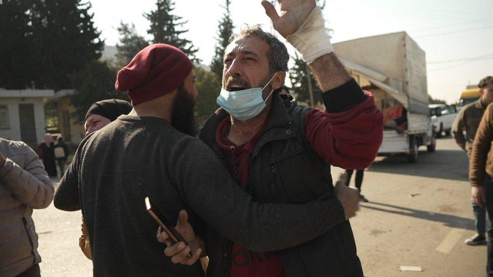 Nouman is held back by Ali at the Bab al-Hawa border crossing