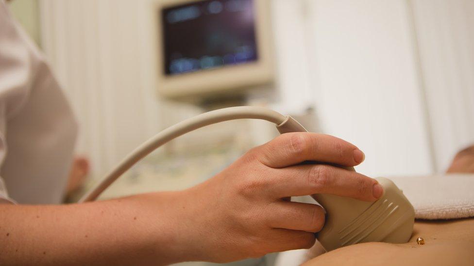 A woman having a baby scan in a hospital