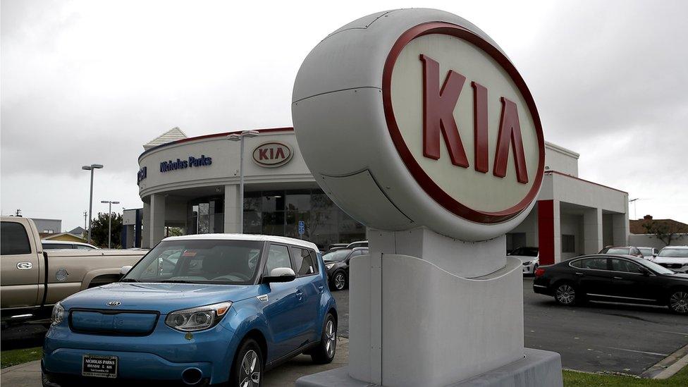 Kia logo at a Hyundai dealership in the US