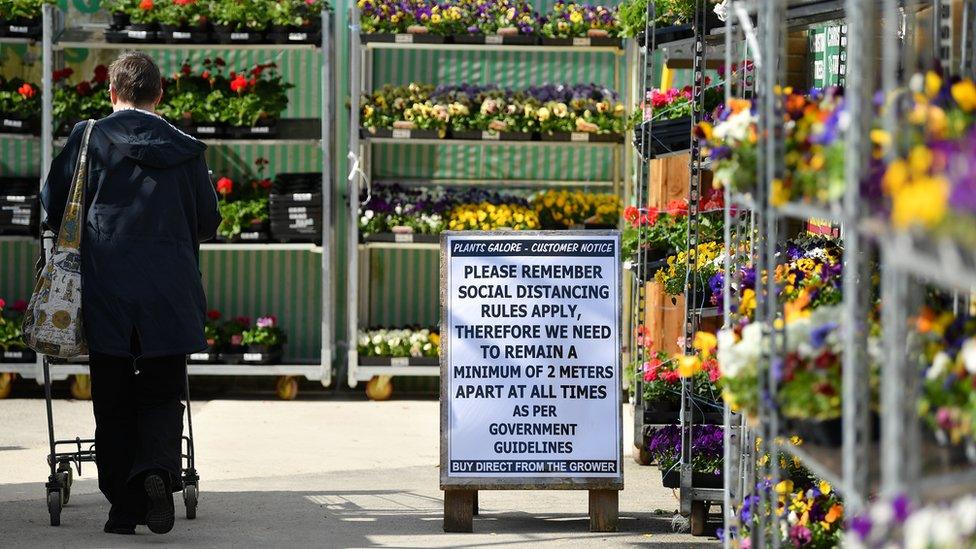 A woman shops at a garden centre in Exeter