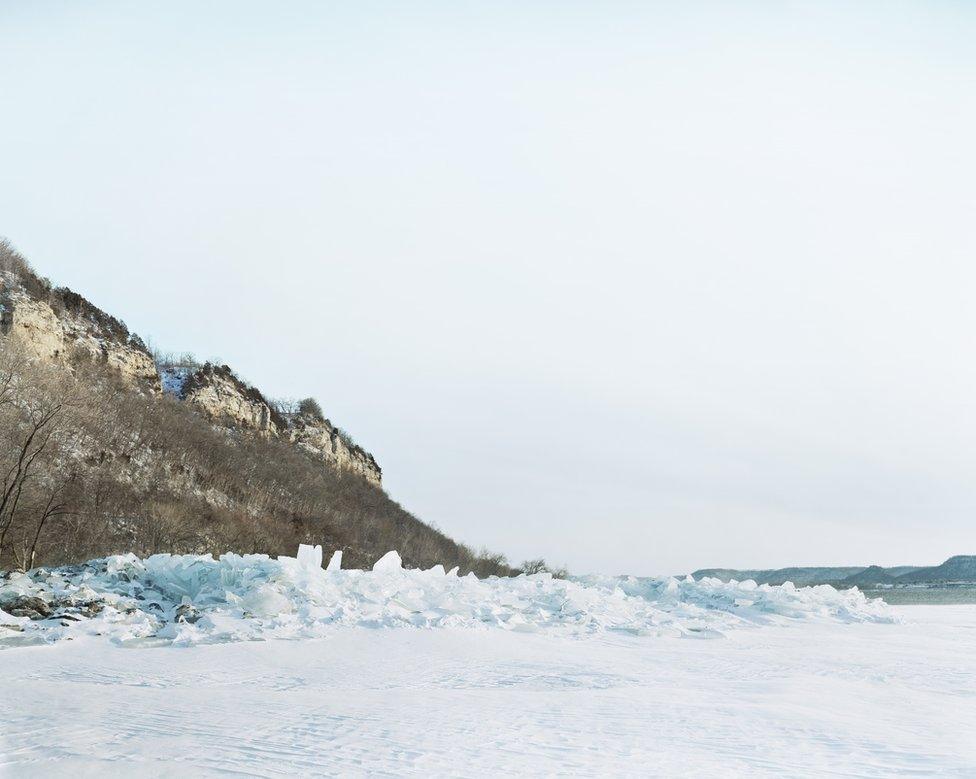 An icy river landscape.