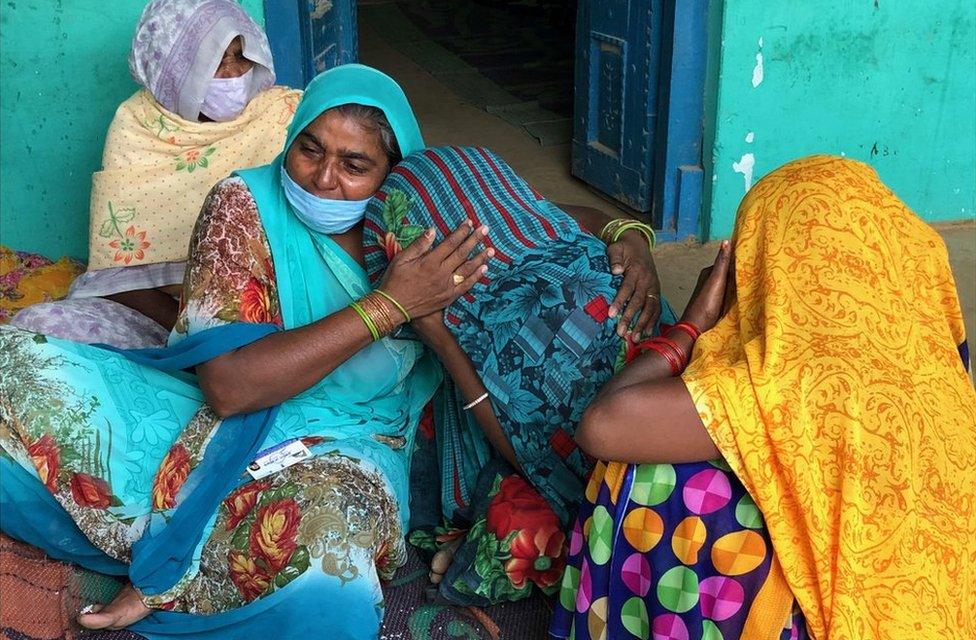 The victim's aunt consoles her mother