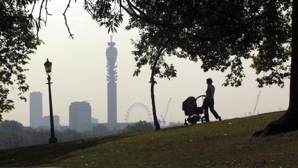 Woman pushing pram