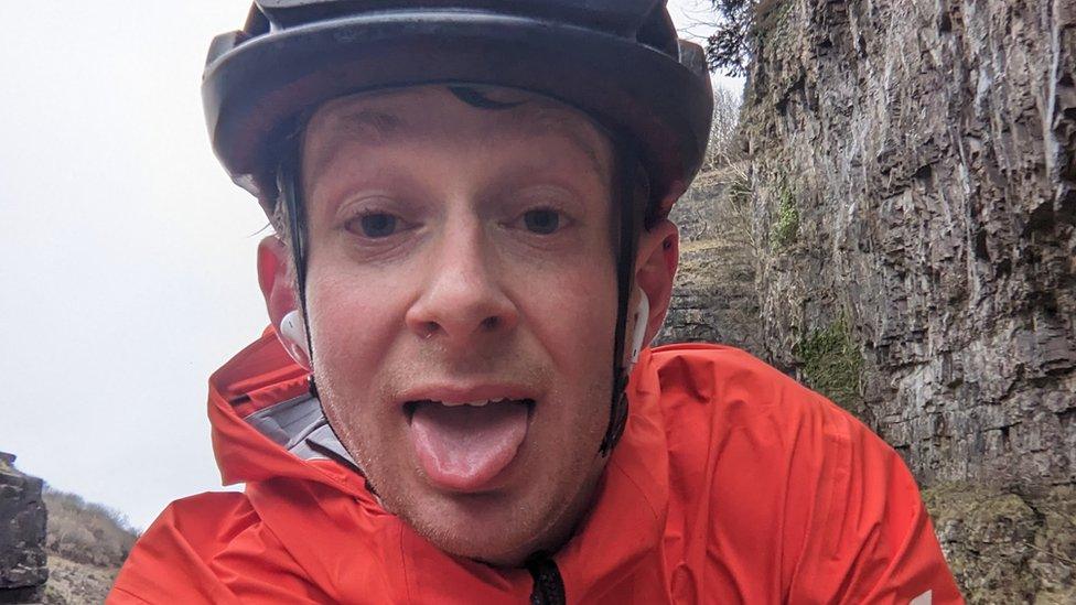 Cyclist with his tongue poking out