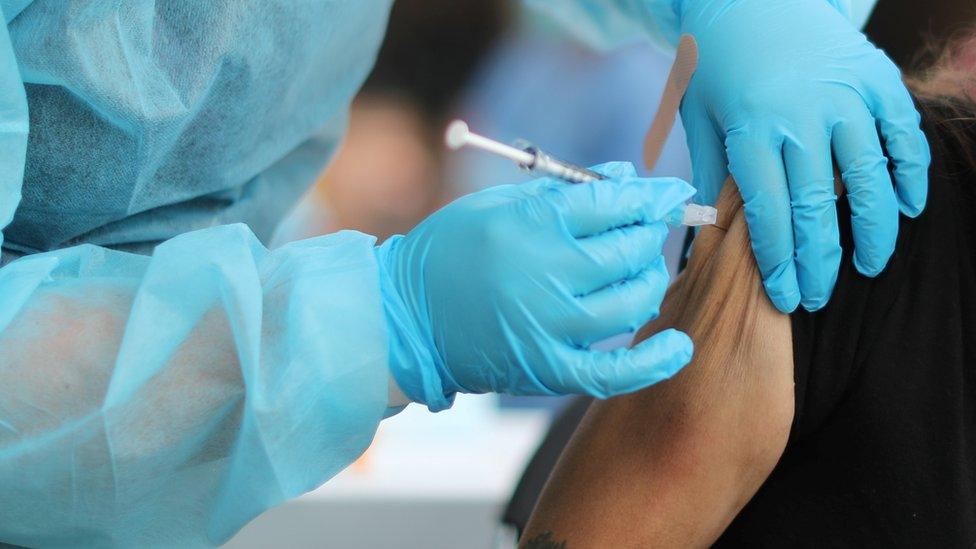 Woman being vaccinated