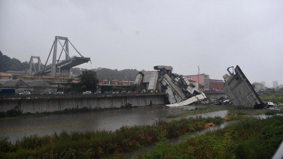 Wide shot shows large section of bridge collapsed, with remaining part exposed