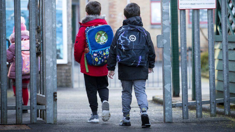 pupils arriving at school