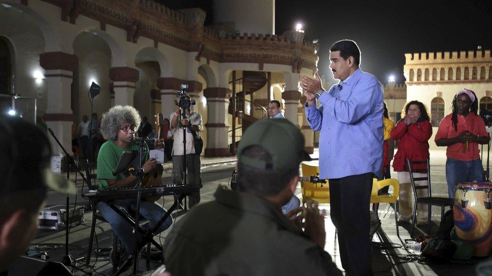 President Nicolas Maduro applauds during his weekly broadcast "en contacto con Maduro" (In contact with Maduro) in Caracas