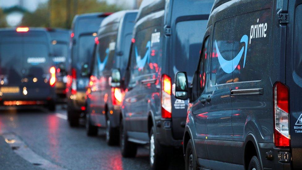 A logo of Amazon Prime is pictured on a vehicle as Extinction Rebellion activists protest outside the Amazon Fulfilment Centre in Altrincham