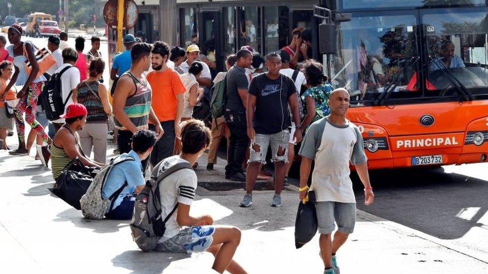 People queue for a bus in Havana, Cuba. Photo: 11 September 2019