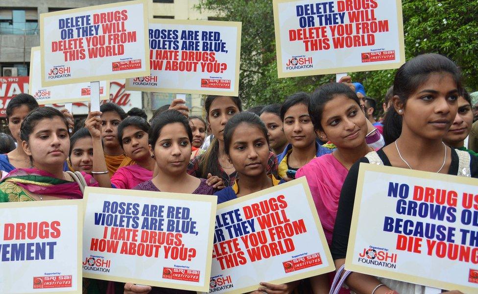 Indian students hold placards as they participate in an anti-drugs awareness march organized by the Joshi Foundation in Amritsar on April 7, 2015.