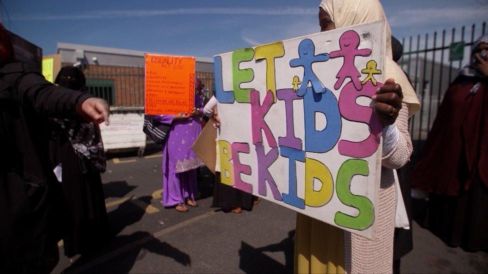 A protester holding a placard