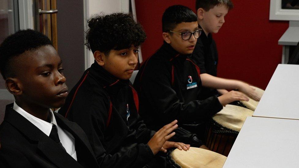 Pupils at Shireland CBSO Academy learning West African drumming