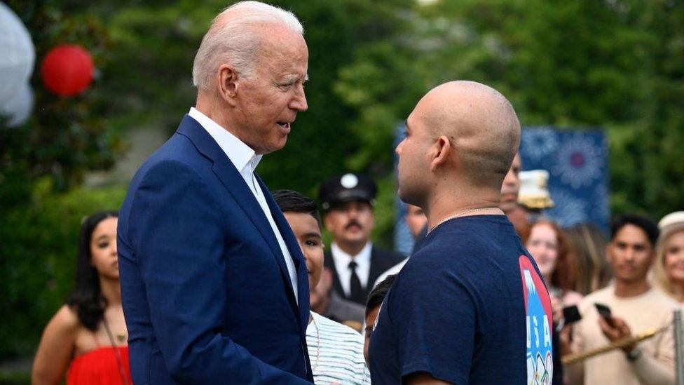 President Biden shakes hands with a voter