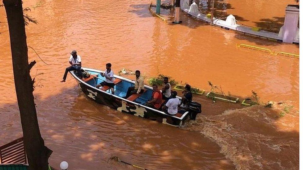 Rescue workers on boats in Sangli on their way to evacuate people.