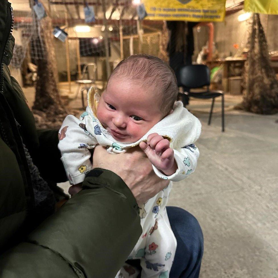 A baby pictured in an air raid shelter