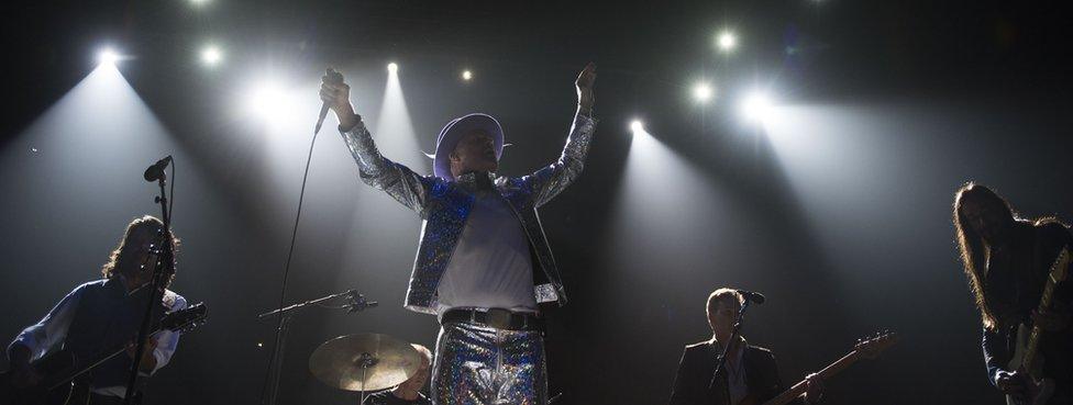 The Tragically Hip performing under spotlights during their last tour. 10 August 2016