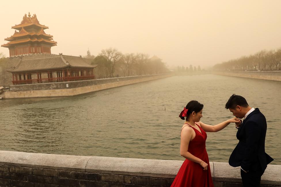 A couple during a wedding photoshoot near the Forbidden City, Beijing, on 15 March 2021