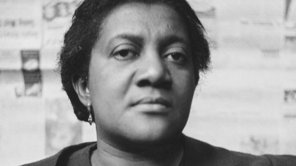 Director of the Black Star Line Steamship Corporation, co-founder of the Negro World newspaper, and first wife of Marcus Garvey, Amy Ashwood Garvey stares at the camera at the Fifth Pan-African Congress, held at Chorlton-upon-Medlock Town Hall in Manchester,