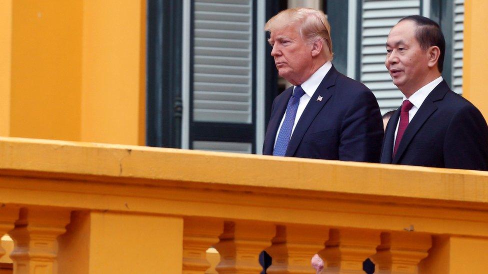 US President Donald Trump and Vietnam's President Tran Dai Quang walk to a news conference at the Presidential Palace in Hanoi, Vietnam November 12, 2017.