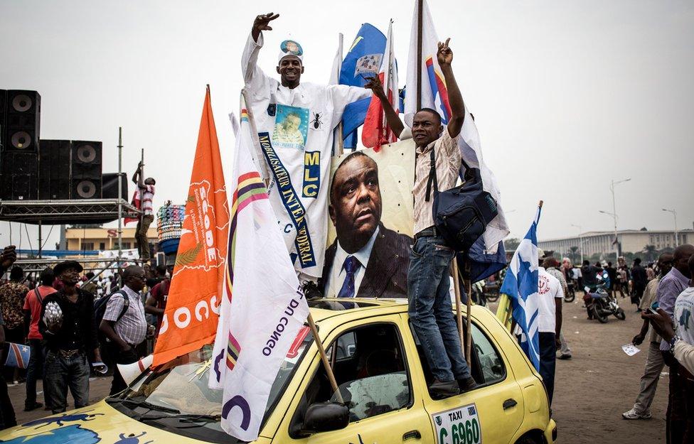 Supporters celebrate ahead of an opposition rally where the main opposition presidential candidates will address supporters three months before the upcoming elections on September 29, 2018 in Kinshas