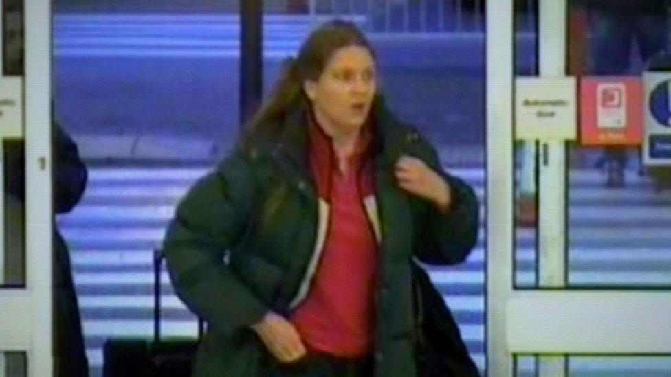 Annie wearing a large coat and backpack on CCTV footage