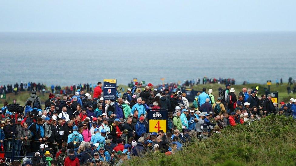 Crowds are seen walkin the course during a practice round prior to the 148th Open Championship held on the Dunluce Links at Royal Portrush Golf Club on July 17, 2019 in Portrush