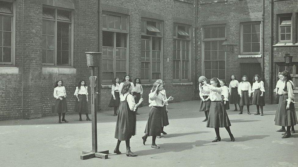 Girls playing netball. Black and white old image.