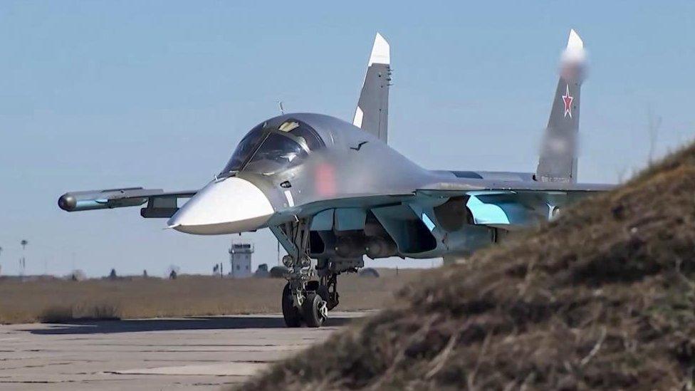 A handout still image taken from a handout video made available by the Russian Defence Ministry's press-service shows a Russian fighter-bombers Su-34 preparing to take off to carry out an air strike in Ukraine, 20 April 2022.