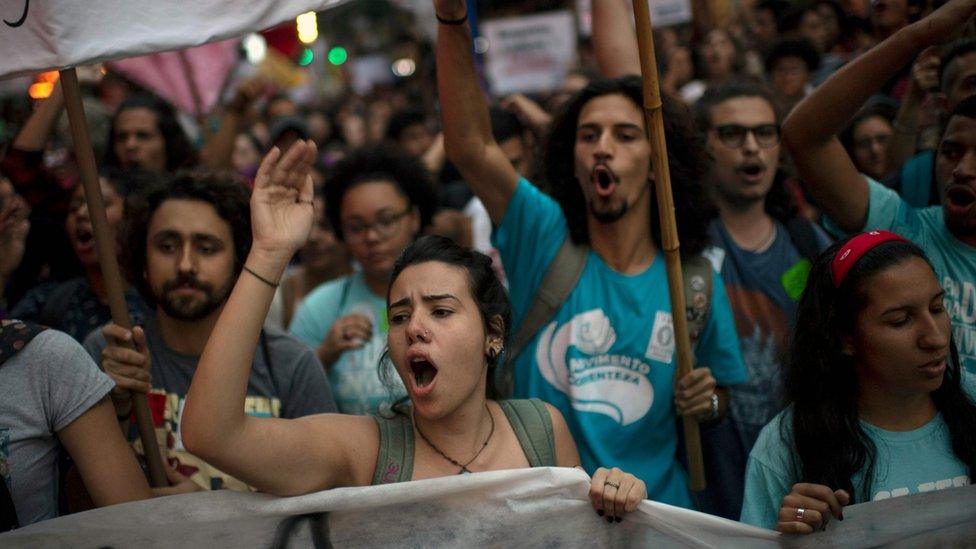 Women shout slogans during a protest against President Jair Bolsonaro"s education budget cuts